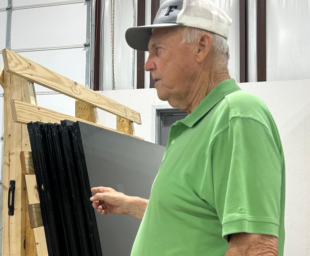 Founder Gary Shepard explaining the process of making frames and cutting windows to the size needed